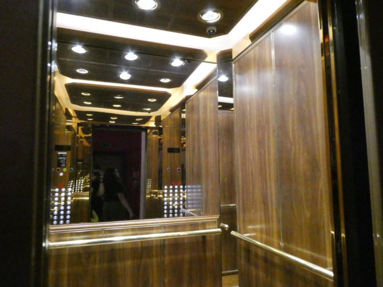 The golden lift, complete with golden-ish wooden walls and LED spotlights.