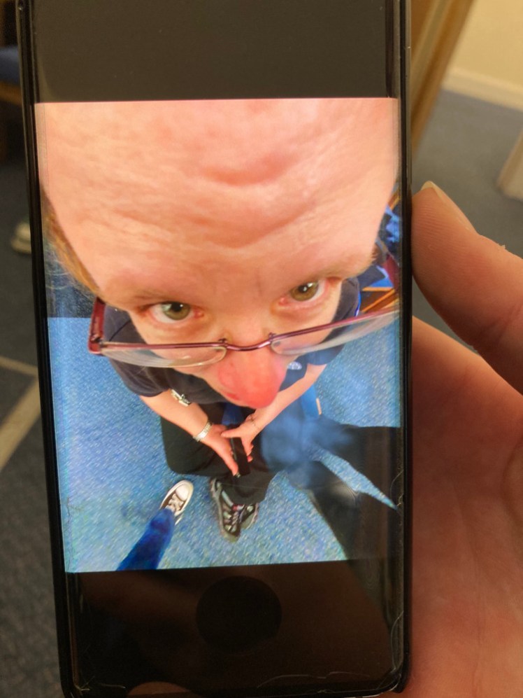 A photo of a Ranger's phone with a photo of me on the screen. The photo is taken from just above and in front of my head and I'm hideously distorted like a cartoon villain. No direct digital contact with under-16s, hence taking the photo of the photo.