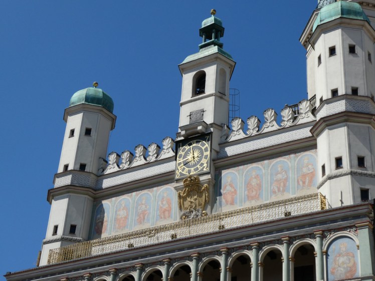 The decorative top and clock tower of Poznan's town hall.