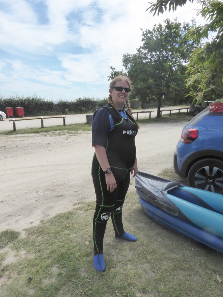 Dressed for kayaking in a long john wetsuit over a rash vest.