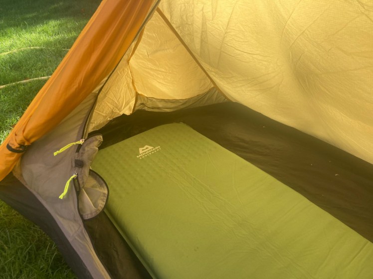 The green mat laid out in the yellow tent. You can see that it occupies pretty much all the floorspace.