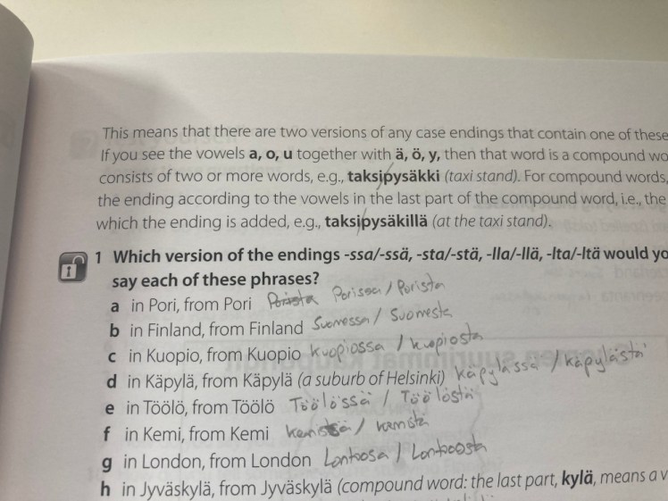 A page from the textbook with an exercise where I have to practice the cases to turn words into "in [place]" and "from [place]".