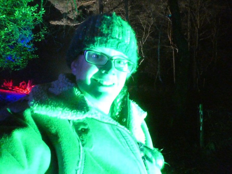 Me, in my woolly hat and sheepskin poncho, grinning at the camera while illuminated in alien-green light. I look like I've been badly photoshopped by a teenager in 2001.