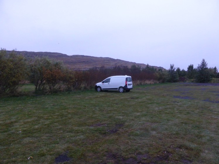 My van parked alone in an empty campsite