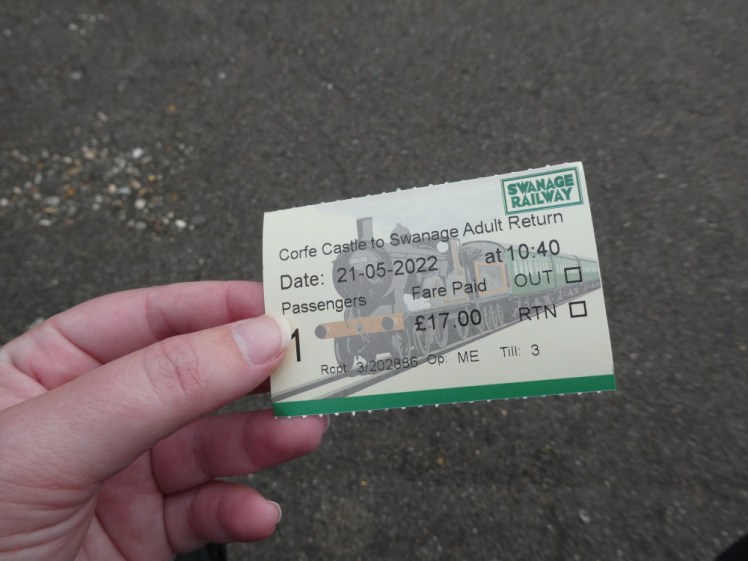 My Swanage Railway ticket, a greenish ticket with a picture of a steam locomotive on it.