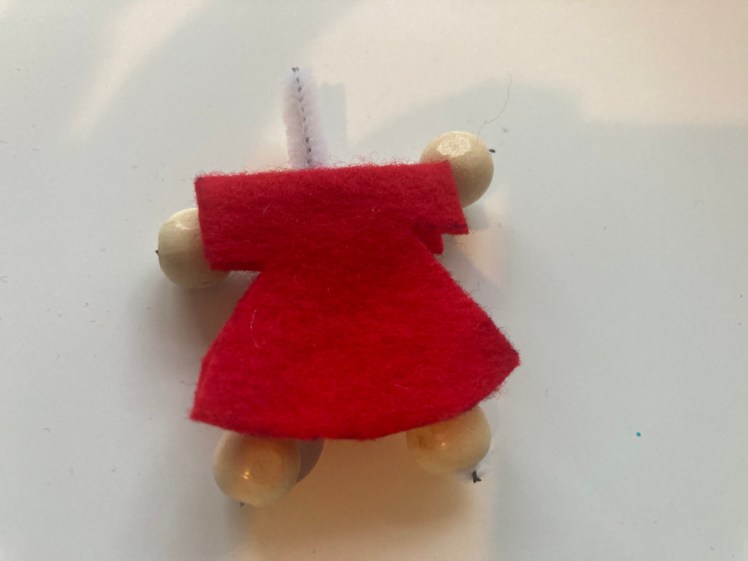 The robe on the skeleton with the pipecleaner neck sticking out. It's not been sewn yet.