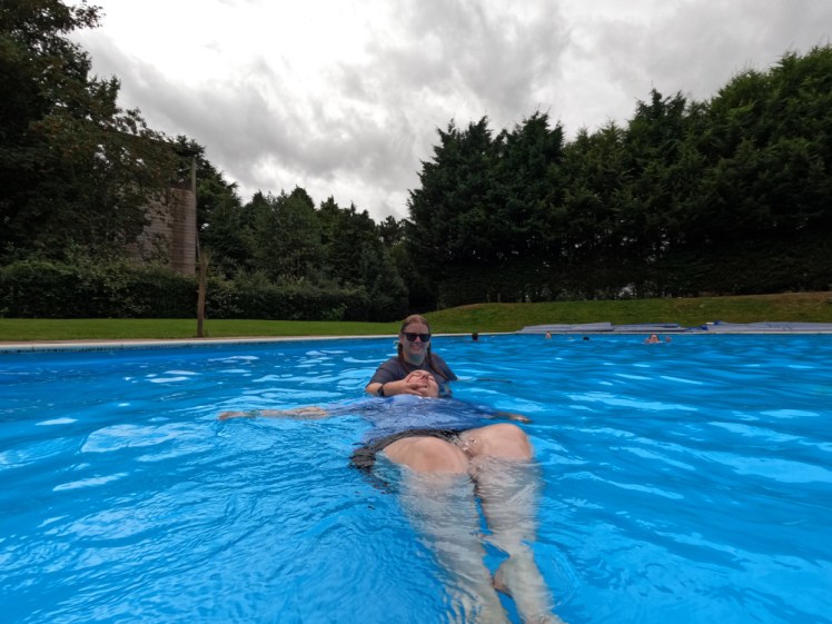 Me and a partner in the pool. I'm pretending to tow her while actually posing for the camera.