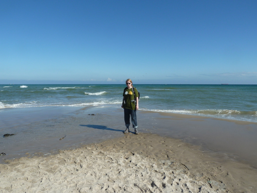 Me on the beach at Grenen, where the Skagerak and Kattegat seas meet - or where the North Sea meets the Baltic. It's quite a triangular point of beach but there's no difference between the two seas. I'm wearing jeans rolled up with a green t-shirt with boots. Should have taken my sandals.