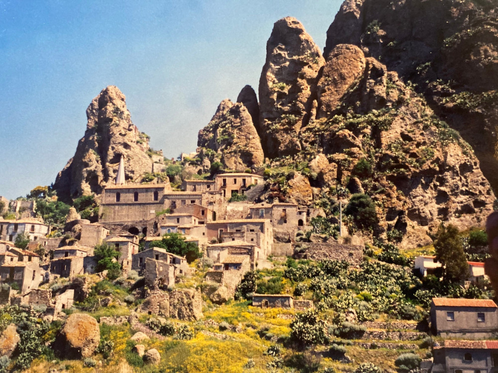 Ancient hillside village of Pentedattilo, named after its unusual rock formations, in the sunshine.