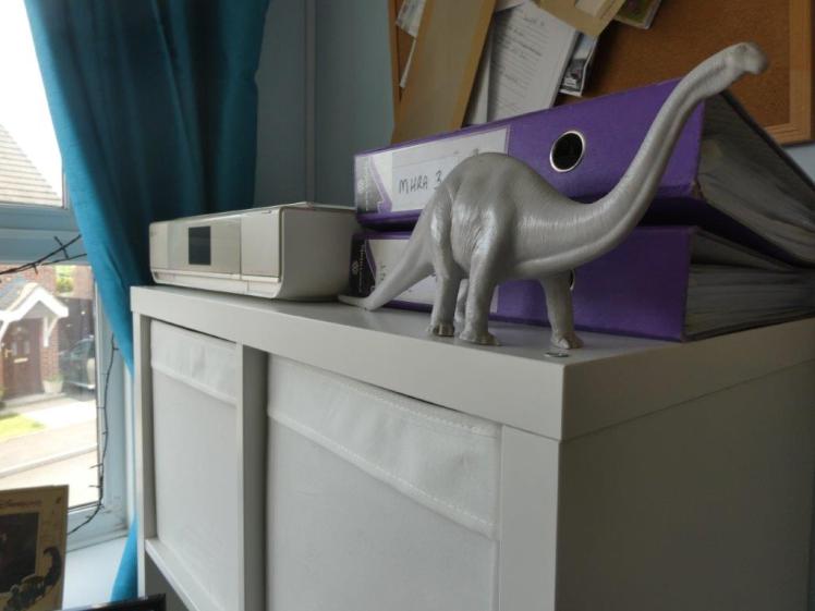 On top of my Kallax is an all-in-one printer, some MHRA files for work and an apatosaurus.