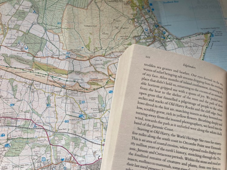 The top half of the second page of chapter 19, about Studland and Old Harry, lying on top of the map with Studland and Old Harry visible.