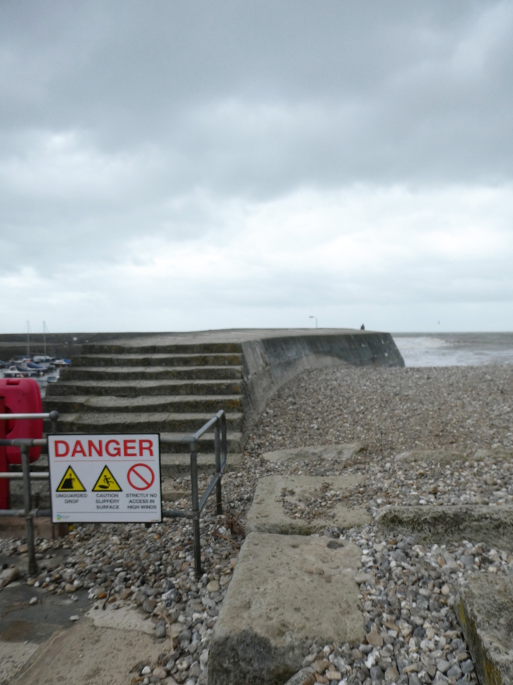 Warnings on the Cobb and a man sitting on top of it