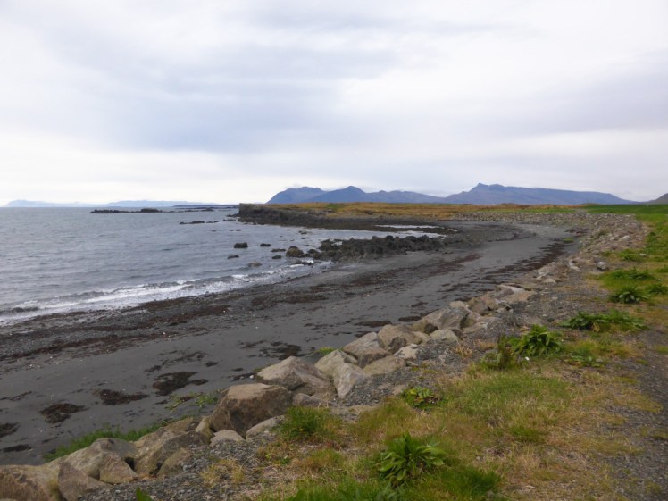The seafront at Akranes by the campsite. The beach here is a lot narrower, with bouldery edges and black sand.