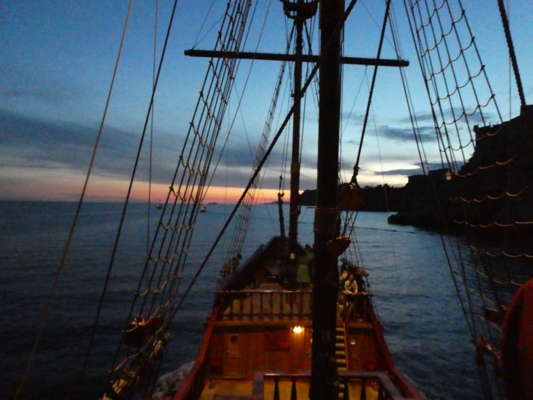 Karaka as seen from the poop deck- its main and forecastle decks visible and gently illuminated by the floodlights above.