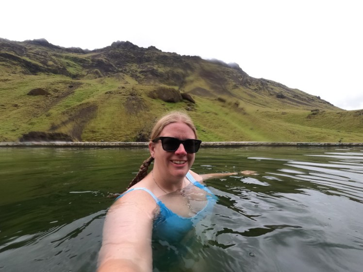 Selfie in Seljavallalaug, a semi-wild swimming pool in the mountains.