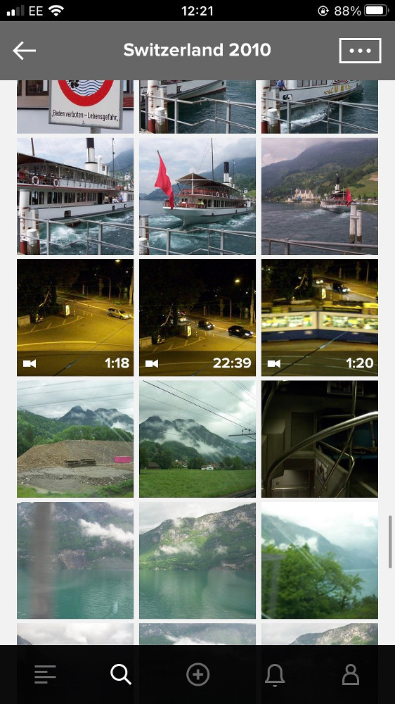 A screenshot of my photo album with three videos taken at night sandwiched between pictures of lakes and mountains. The middle video is 22:39 long; the other two each about 1:20