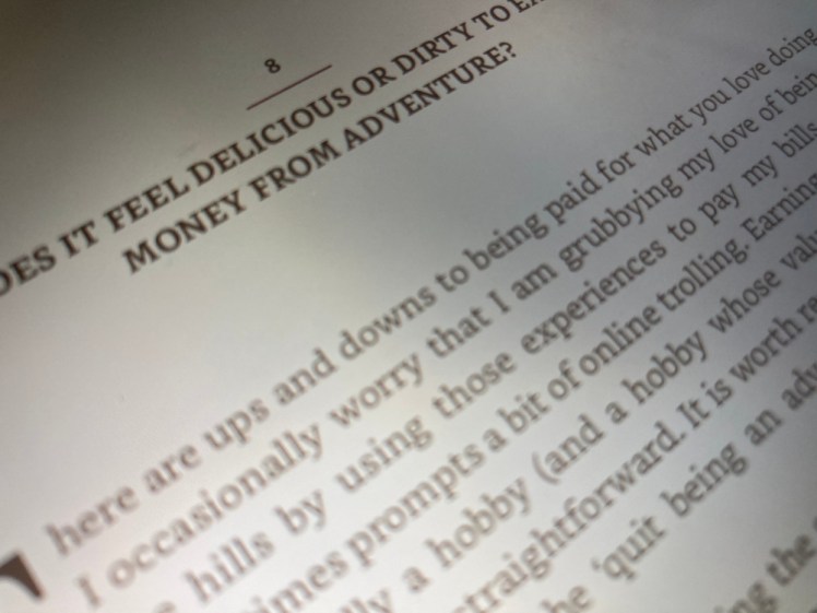 A close-up of a chapter entitled "Does it feel delicious or dirty to earn money from adventure?". Yu can also read most of the first paragraph underneath about Al's thoughts on the question.