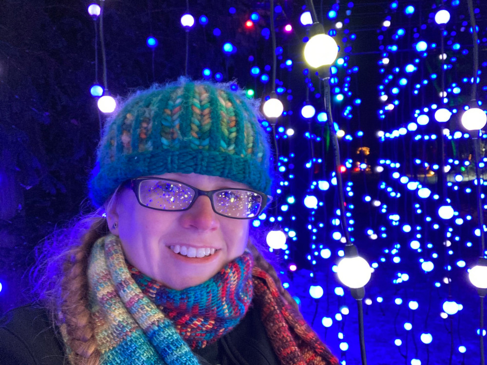 Selfie in the Carillon. This time although most of the lights are blue, the overall effect is of a lot of mid-dark blue. However, my face is lit nicely by the white lights and there are more glittering orbs reflected in my glasses.