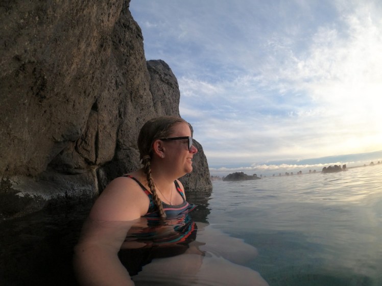 Selfie sitting on an underwater bench at the edge of a low cliff, with the late evening sun on my face.