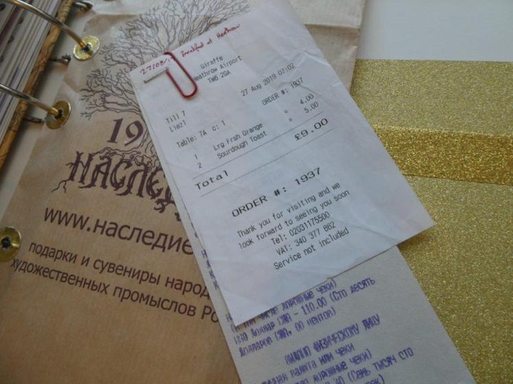 Sample receipt from my Russia scrapbook. It's from the first day, it's all held together with a red paperclip and the top is labelled with the date and description in red pen.