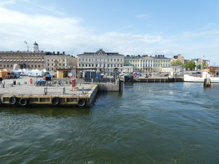 Sailing away from the dock at Market Square on a bright afternoon.