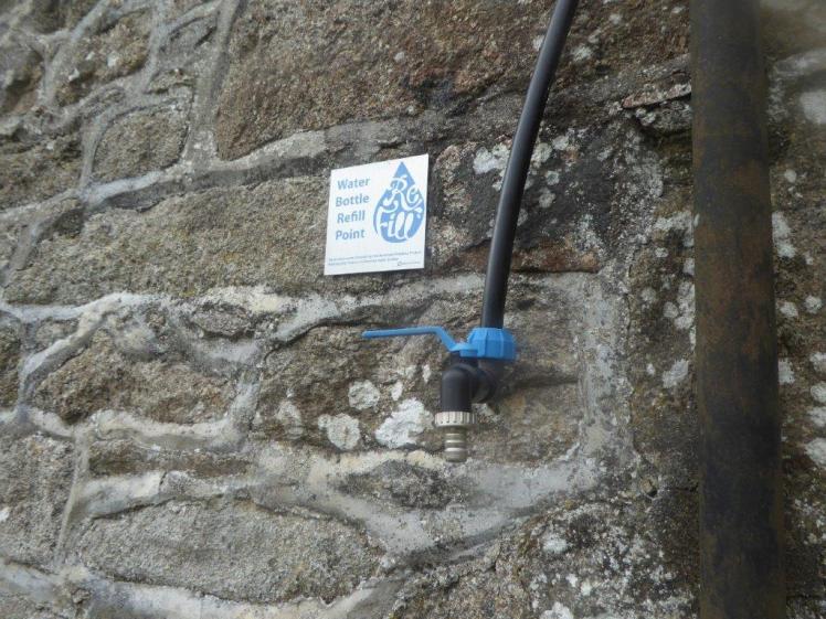 Public water bottle refill point on the side of Challacombe Farmhouse, Dartmoor