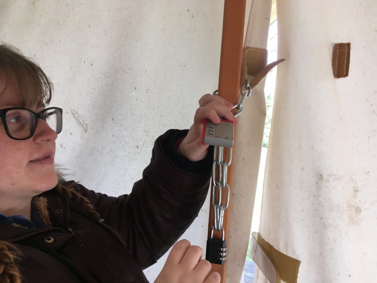 Pixie working on the padlocks in the escape room