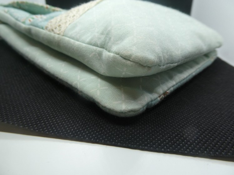 The side/bottom of the bag showing how it's two rectangular bags sewn back to back.