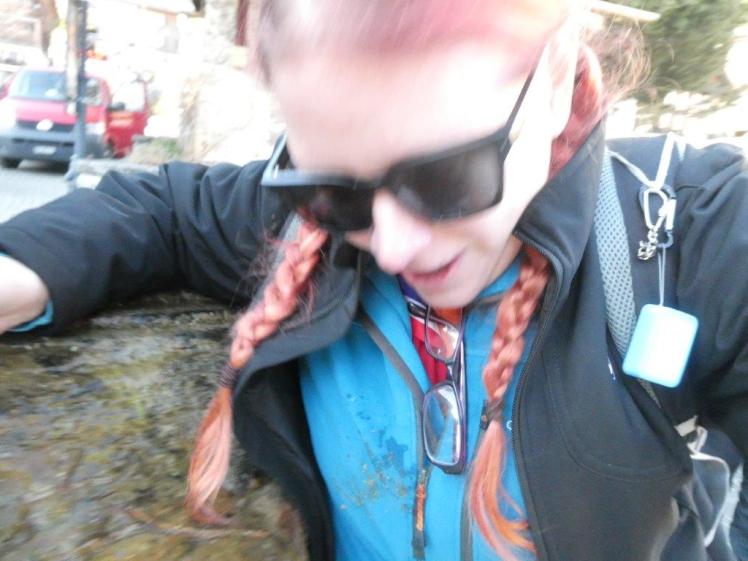 Selfie of putting my nose in the fountain outside Adelboden church