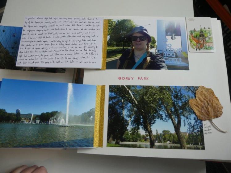 The same page as before. The top photo is folded back to reveal a journalling card on the back and the bottom photo has another photo stuck on its back.