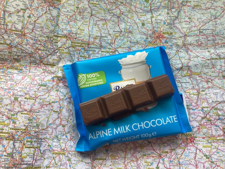 The Ritter bar on its own, chocolate lying on the packet.