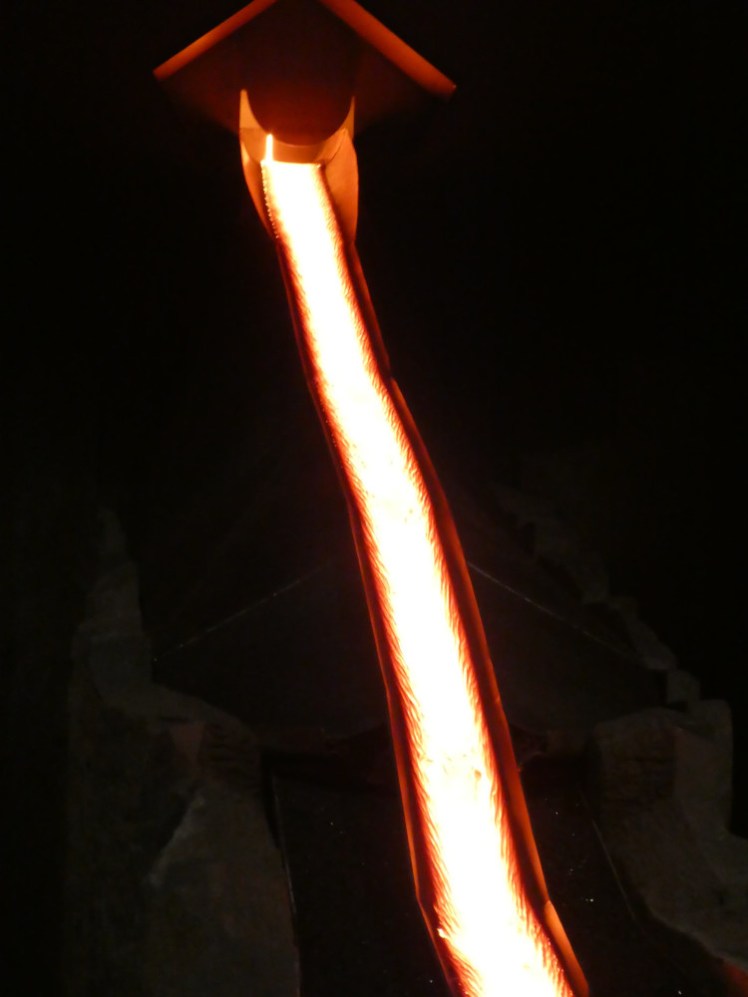 White-hot lava on the steel slide.