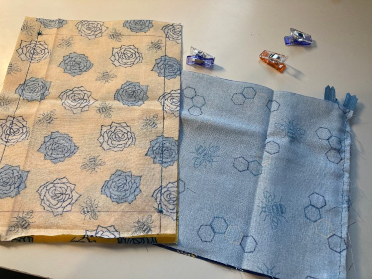 I only took two photos of the process. This is two pieces of yellow mid-fabric sewn good sides together down the long edges and a piece of pale blue fabric sewn down one of the short edges.