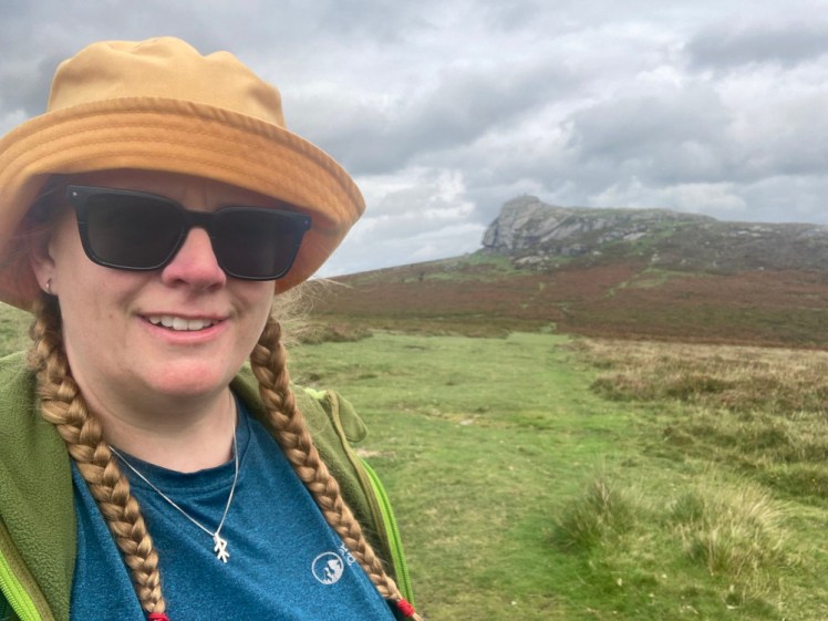 A selfie from Dartmoor with Haytor in the background. I'm wearing my prescription polarised sunglasses. You can also see the blue base layer that I'm wearing in just about every hiking photo on this post.