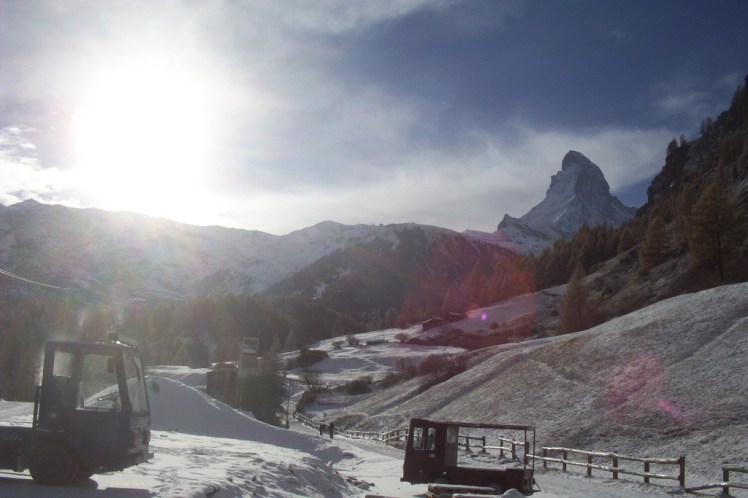 The Matterhorn from the outskirts of Zermatt, all snow-covered fields edged with pine trees and over-dramatic lighting