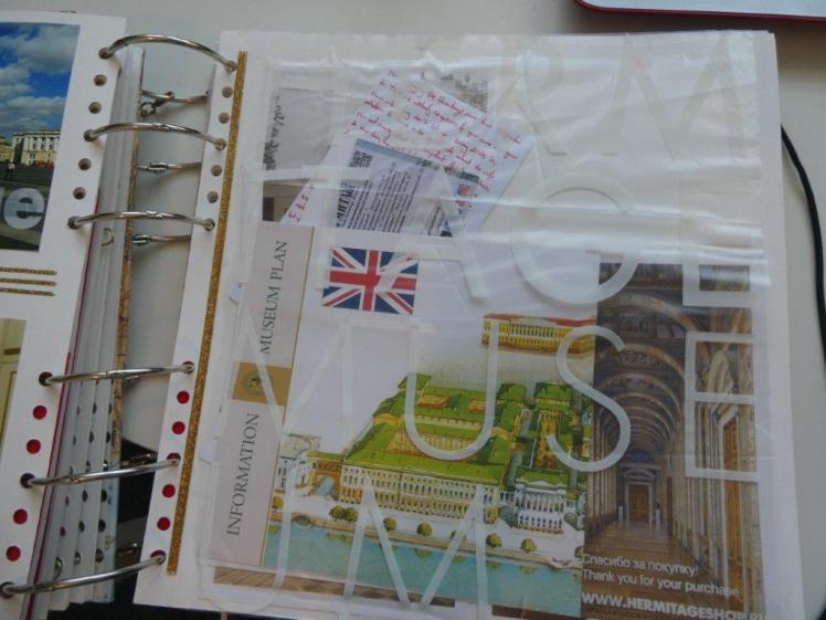 The front of a plastic bag stuck in as a scrapbook page. There are bits and pieces of scrap inside/underneath it.