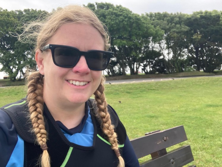 Pre-kayak selfie, in which you can see the top of the wetsuit & its velcro shoulder straps. I'm wearing it over the blue rash vest again. Judging from my plaits, I haven't redone my hair after getting it damp the day before.