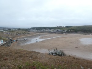 Bude Summerleaze beach at low tide. It's from much the same angle as the earlier high tide photo but now it's just an expanse of sand with some patches of wet.