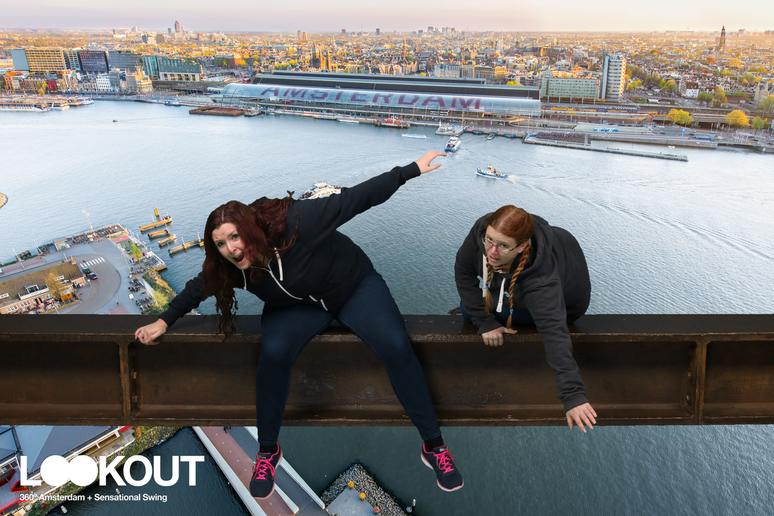 My sister and I pretending to fall off a beam at ADAM Lookout. My hair is confined in plaits, as usual. Hers, which is fairly long and fairly thick, quite a lot darker than mine and a touch more reddish-purple, is loose. It's far too much hair to not brush for six days.