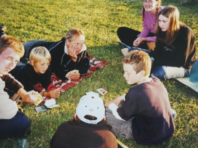 Playing cards with the teachers in the sun in the evening