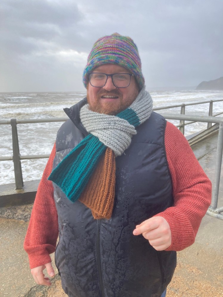 Tom soaked from a wave splashing up onto the prom.