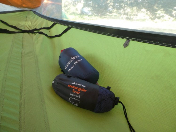 My camp bed - an inadequate sleeping bag liner and pillow