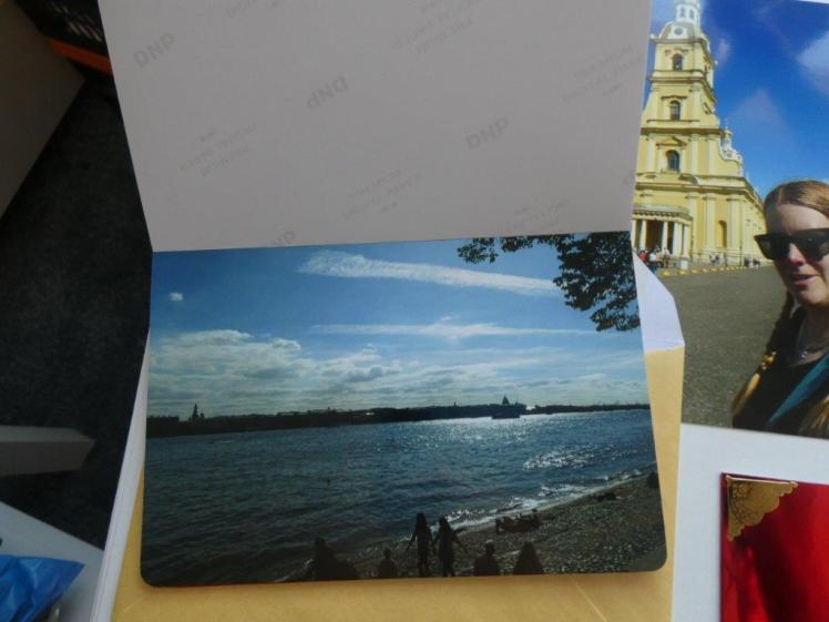 Inside the handmade perfect bound minibook. It's handful of photos bound at the top spine with PVA glue.