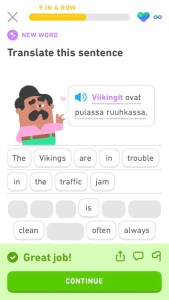 A screenshot from Duolingo showing a Finnish sentence translated word-by-word into English to read "The Vikings are in trouble in the traffic jam".
