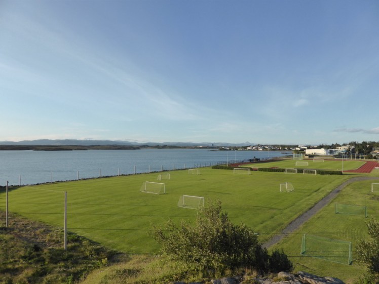 The view across the sports field and the fjord