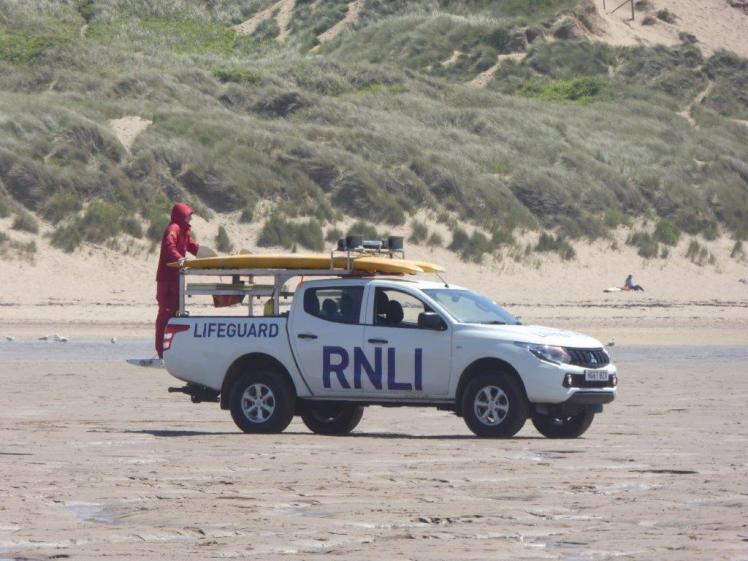 RNLI lifeguards on the beach
