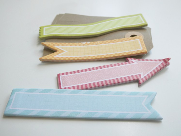 A collection of kraft brown luggage labels and semi-sticky