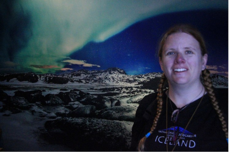 A greenscreen postcard machine picture of me admiring the Northern Lights over the mountains.