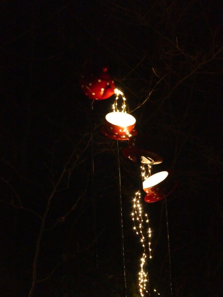 Teapot pouring streams of light