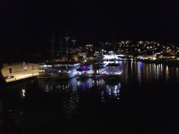 Three massive party boats moored alongside each other to make one giant floating party club.
